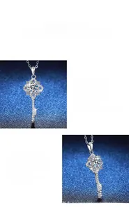 Macro view of S925 silver four-leaf clover key pendant with brilliant moissanite stone