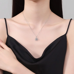 S925 sterling silver moissanite necklace with elegant circular pendant on a female model