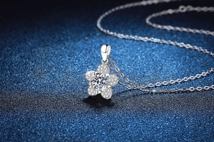 Macro shot of S925 sterling silver camellia pendant with 1ct moissanite center stone