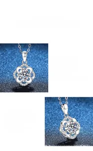 Close-up of S925 silver four-leaf clover pendant with 1 carat moissanite and polished finish