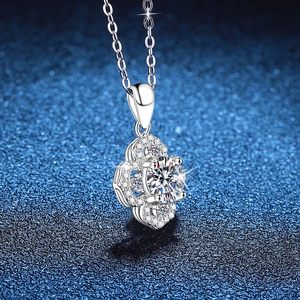S925 sterling silver four-leaf clover necklace with 1 carat moissanite on blue background