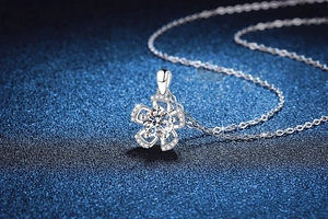 Detailed macro view of S925 silver flower pendant with brilliant round moissanite center