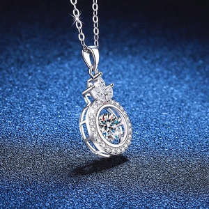 S925 Sterling Silver Dancing Moissanite Crown Pendant Necklace on Dark Blue Texture
