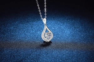 Macro detail of S925 sterling silver teardrop pendant with 1ct moissanite stone