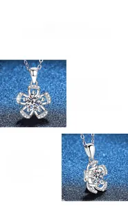 Macro view of flower-shaped pendant featuring a brilliant moissanite stone in S925 silver
