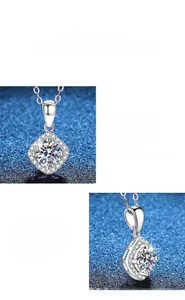 Close-up of sparkling halo-set moissanite pendant with brilliant round cut on silver necklace