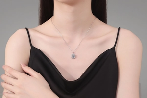 Close-up of sparkling heart-shaped moissanite pendant on S925 sterling silver chain