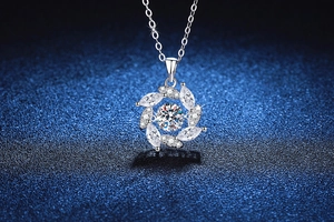 Macro shot of a rotating windmill pendant with a 1ct moissanite center in S925 silver