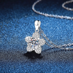 S925 sterling silver camellia pendant necklace with 1 carat moissanite on blue background
