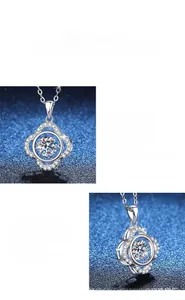 Macro shot of polished S925 silver four-leaf clover pendant with sparkling moissanite stone