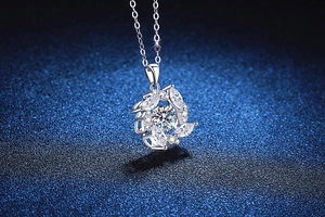 Macro detail of S925 silver necklace featuring a sparkling windmill moissanite pendant