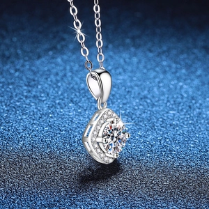 Minimalist s925 sterling silver necklace with 1 carat moissanite pendant on blue background