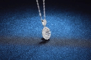 Detail of S925 sterling silver halo necklace with 1ct moissanite pendant on starry background