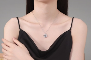 Close-up of S925 sterling silver windmill necklace with sparkling 1 carat moissanite