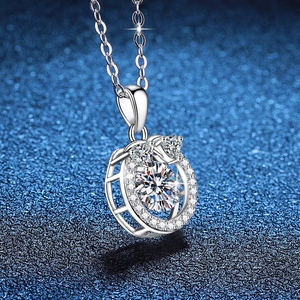 S925 sterling silver necklace with 1ct moissanite heart pendant on a glitter background