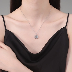 Elegant S925 sterling silver necklace featuring a dancing 1 carat moissanite pendant on model