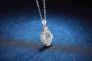 Macro detail of dancing moissanite pendant in S925 sterling silver on starry background