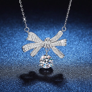 Elegant S925 sterling silver bow pendant necklace with 2ct Moissanite on blue background