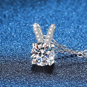 S925 sterling silver necklace with rabbit ear moissanite pendant on starry background