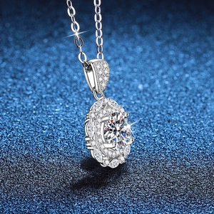 Sparkling S925 sterling silver necklace with 1 carat moissanite pendant on blue background