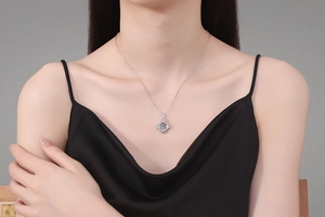 Close-up of S925 sterling silver moissanite pendant necklace on a model's neck