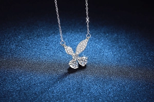 Close-up of a 925 sterling silver butterfly necklace with 1 carat moissanite and micro-pave
