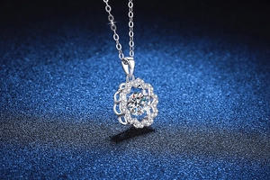 Detailed view of S925 silver necklace with sparkling 1ct moissanite flower pendant