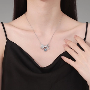 S925 sterling silver necklace with sparkling bow pendant and 2ct moissanite on model