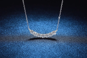 Close-up of sparkling 1.4 carat Moissanite smile pendant necklace in s925 silver