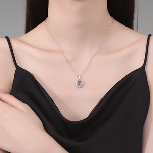 S925 sterling silver necklace with a sparkling 1 carat moissanite pendant on a model