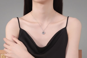 Close-up of S925 silver dancing stone necklace with sparkling 1ct moissanite on model
