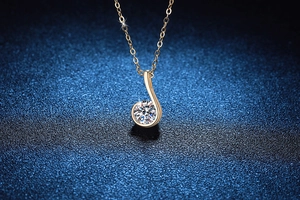 Macro view of 1ct Moissanite pendant with musical note design on dark textured background