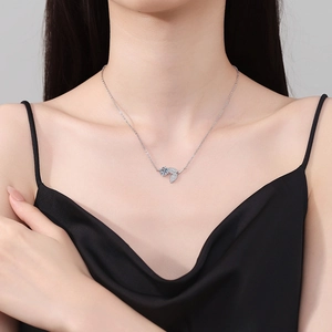 925 silver leaf necklace with 1 carat blue moissanite pendant on a model