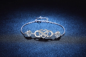 Macro shot of S925 sterling silver infinity heart bracelet with moissanite accents