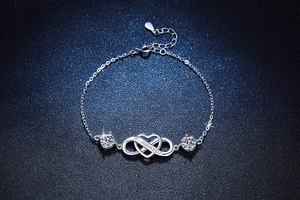 Macro detail of S925 sterling silver infinity heart bracelet with adjustable clasp