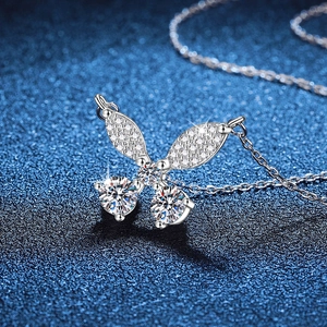 925 Sterling silver butterfly necklace with sparkling moissanite pendant on blue background
