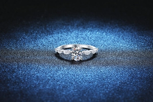 Macro detail of S925 silver ring with 1 carat oval moissanite and marquise side stones