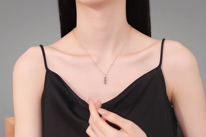 Detail of S925 sterling silver necklace with three vertical blue moissanite stones