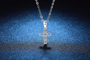 Detailed close-up of 925 sterling silver cross pendant with six round moissanite stones