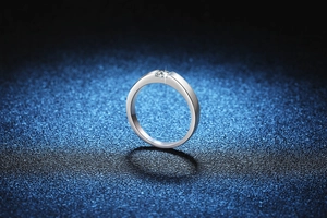 Macro detail of S925 sterling silver ring featuring a sparkling moissanite solitaire stone