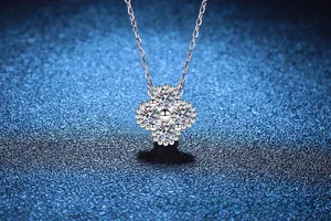 Macro shot of S925 sterling silver four-leaf clover pendant with sparkling moissanite