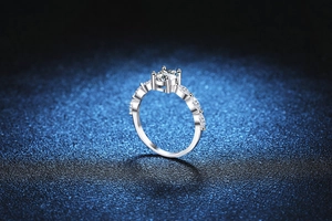 Detailed close-up of a 1-carat oval moissanite ring with marquise cut side stones