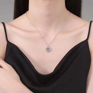 Sparkling S925 sterling silver flower necklace with 1-carat moissanite on female model