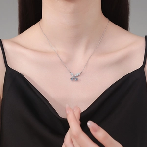 Elegant S925 sterling silver butterfly pendant necklace with 1 carat moissanite on model