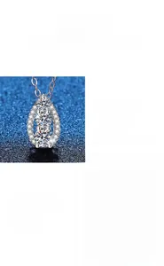 Macro detail of pear-cut moissanite pendant in S925 silver with drop design and side view
