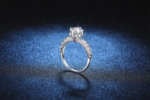 Detailed macro of 3 carat moissanite ring with twisted pave band and pink accent stone