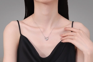 Moissanite S925 silver heart pendant necklace shown on a model with elegant detail
