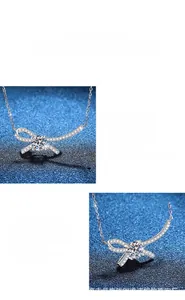 Dettaglio del ciondolo a fiocco in moissanite con pietra tonda e pavé di diamanti