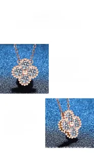 Detail view of rose gold four-leaf clover pendant with sparkling moissanite stones