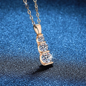 925 silver necklace with three vertical graduated moissanite stones on a gold chain